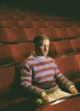 Tom from Rhumba Club sitting in an empty theatre