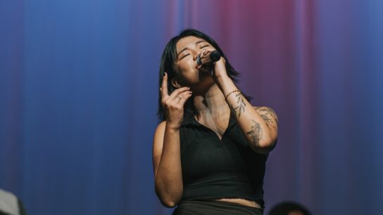 Young female singer performing on stage