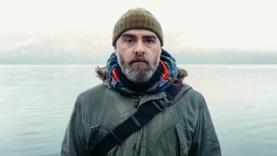 Man standing by a lake